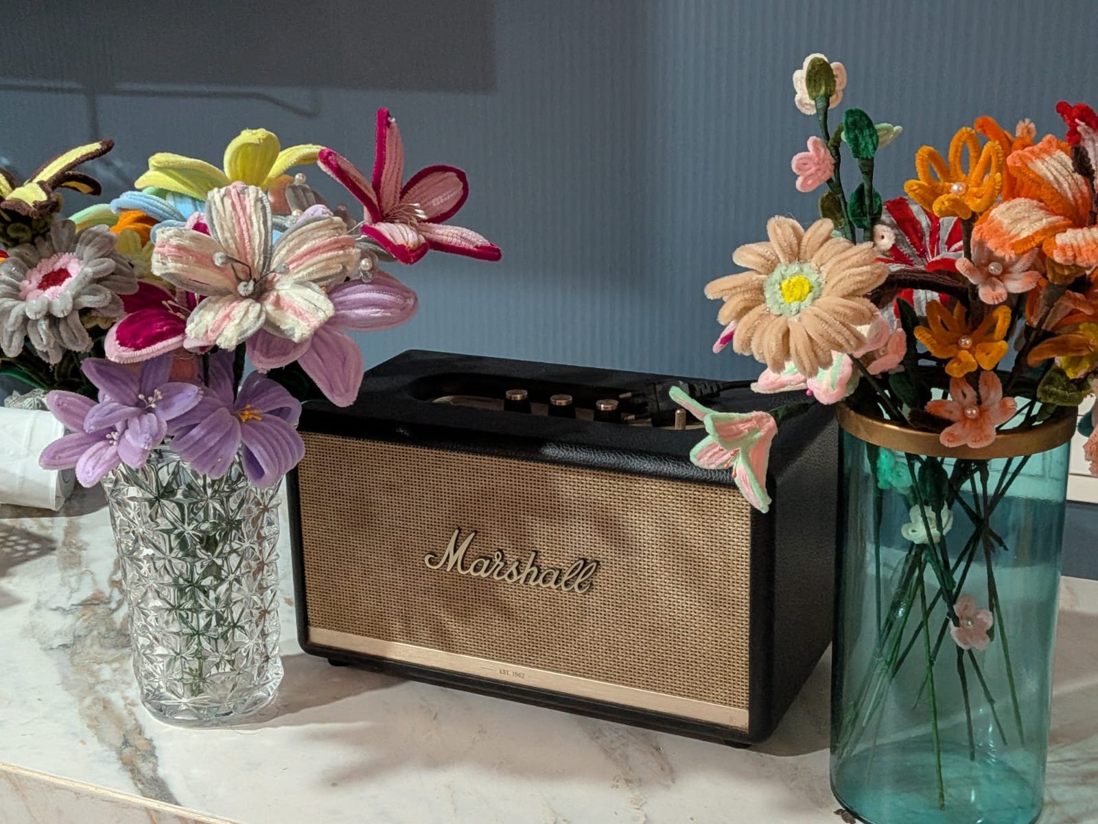 Two crochet flower bouquets in pastel and warm tones