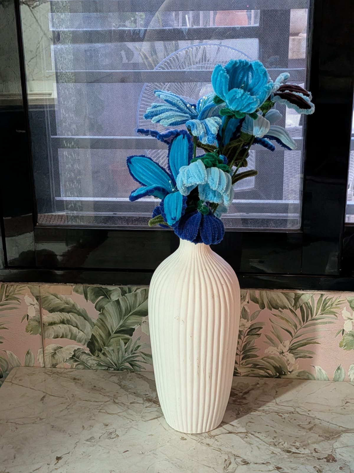 Handcrafted crochet flower bouquet in teal and blue tones